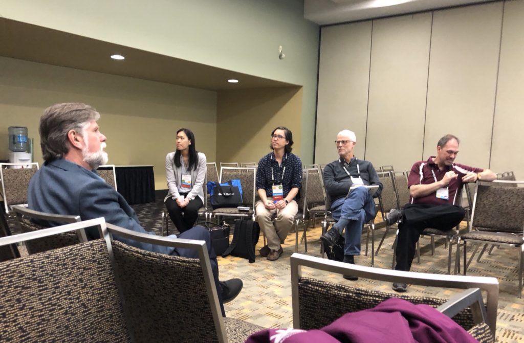 Session attendees sitting in a circle