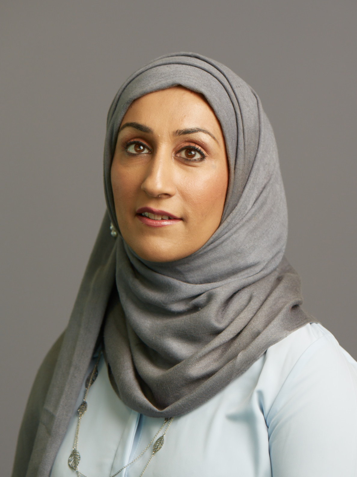 Sam Latif smiling at the camera